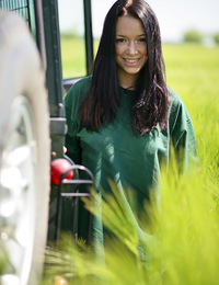 Gwen A: Artemis by Jan Kruml - Gwen playfully strips her green shirt matching the green grassy field and poses naughtily all over the jeep, flaunting 